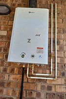 Gas geyser on brick wall 135x200